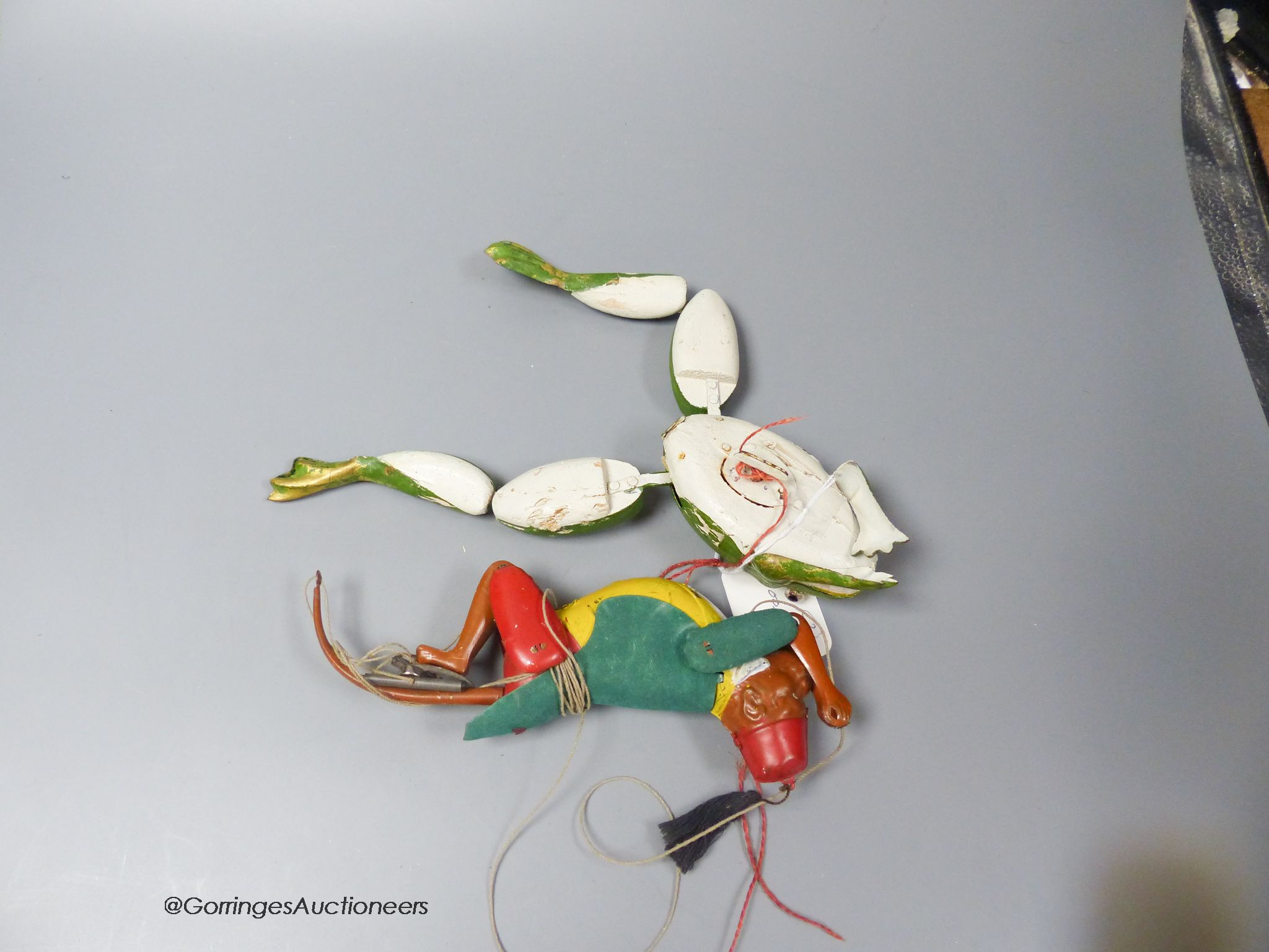 A Lehman tinplate EPL385 climbing monkey, with green felt coat, yellow waistcoat and red fez, together with a clockwork carved wood frog (2)